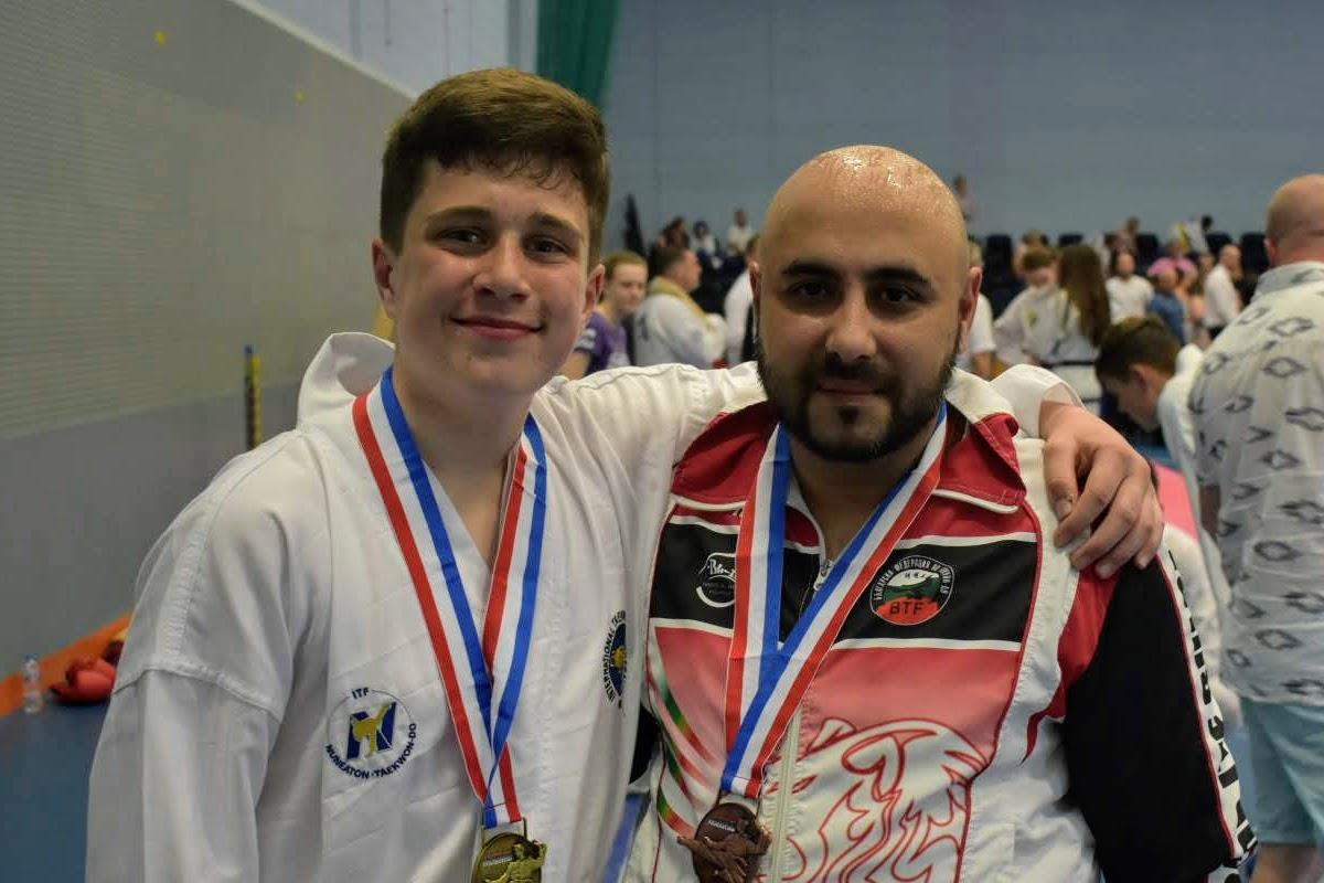 Two Martial Arts students with medals