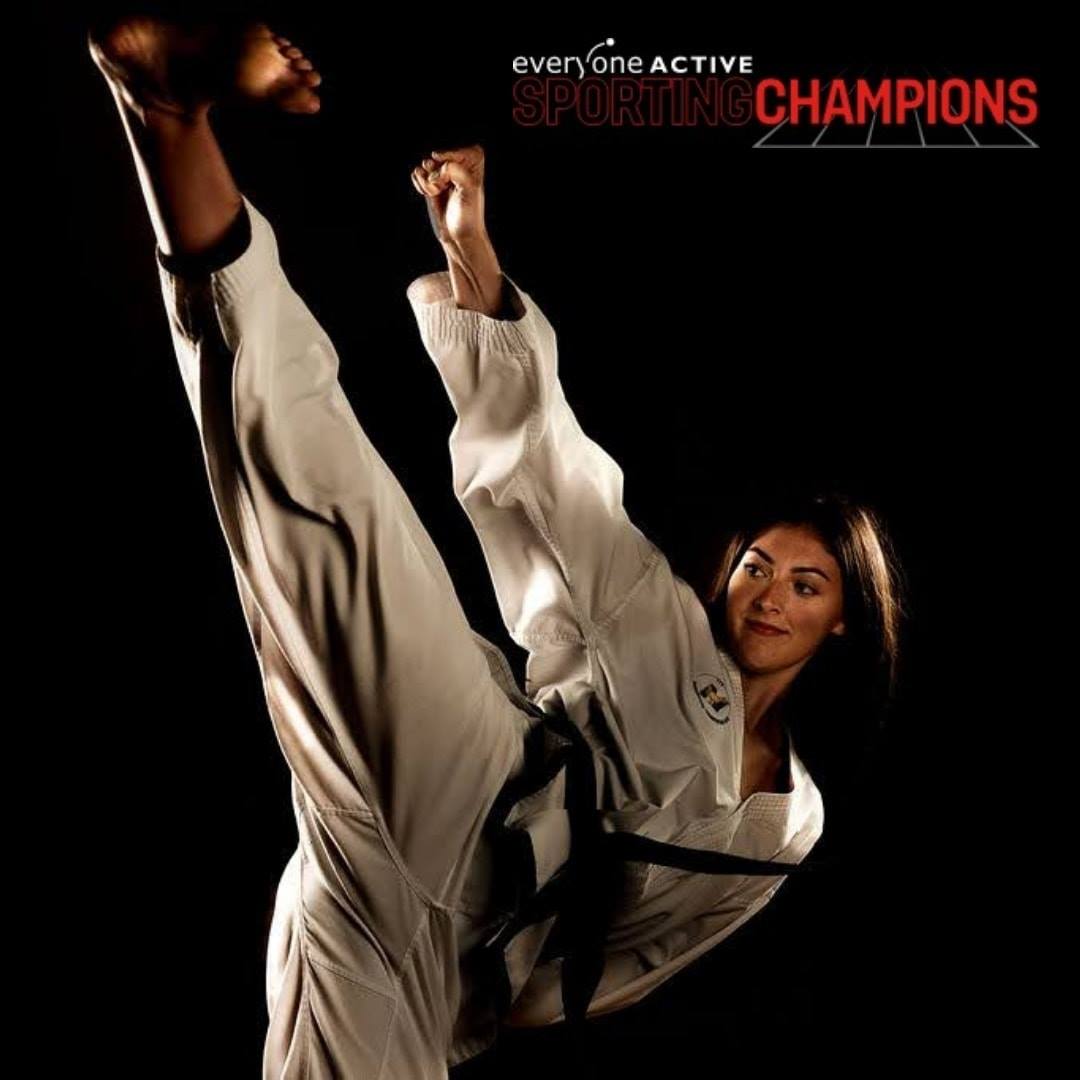 Martial Artist side kick on black background