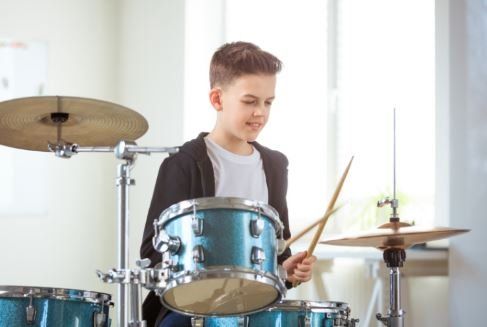 Boy playing drums