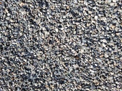 Close-up of gray and white gravel stones filling the frame