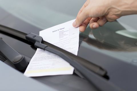 Traffic Ticket Attorney — Man Placing Ticket on The Car Windshield in Chesterfield, VA Traffic Ticket Attorney — Man Placing Ticket on The Car Windshield in Chesterfield, VA