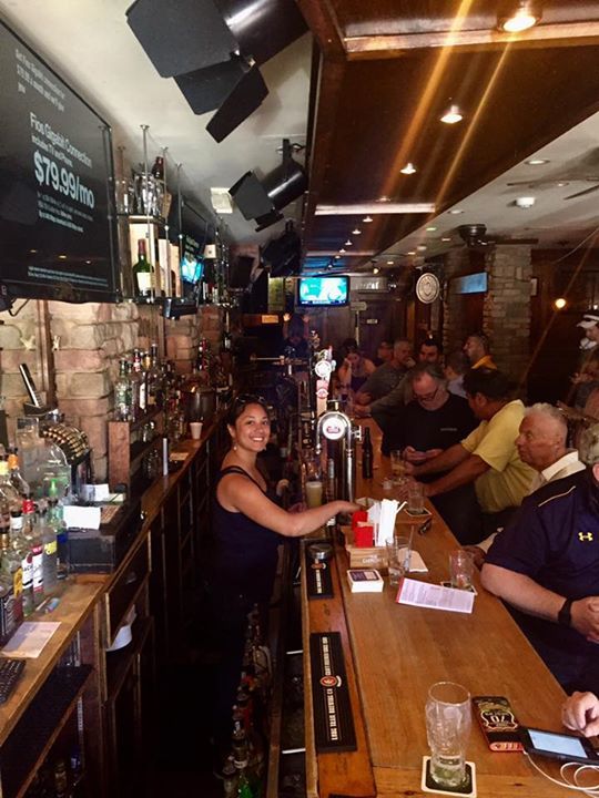A bar with a sign that says styles on it