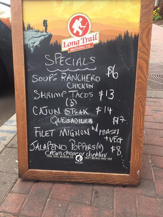 A long trail restaurant chalkboard advertising specials