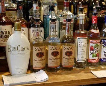 Several bottles of alcohol including tito 's rum chata