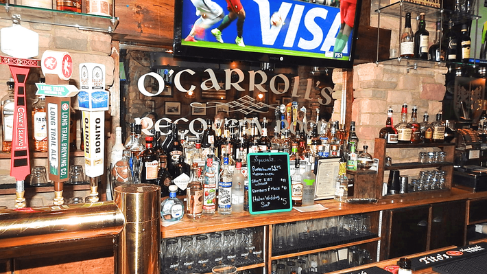 A bar with a sign that says visa on it
