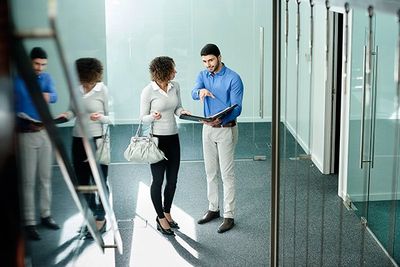 A property manager walks through a property with a potential client.
