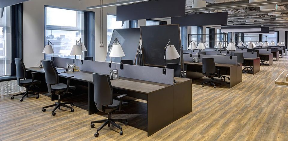 A modern office space with wood floors.