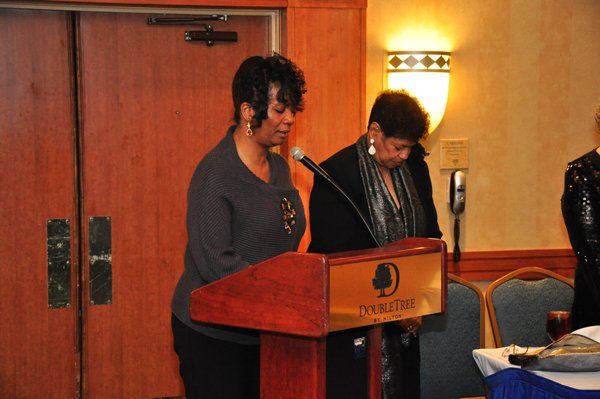 Two women at a podium, 