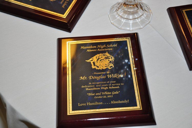 Plaque awarded to Mr. Douglas Williams, with school logo and text.