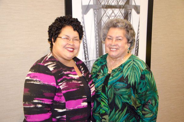 Two women smile, 