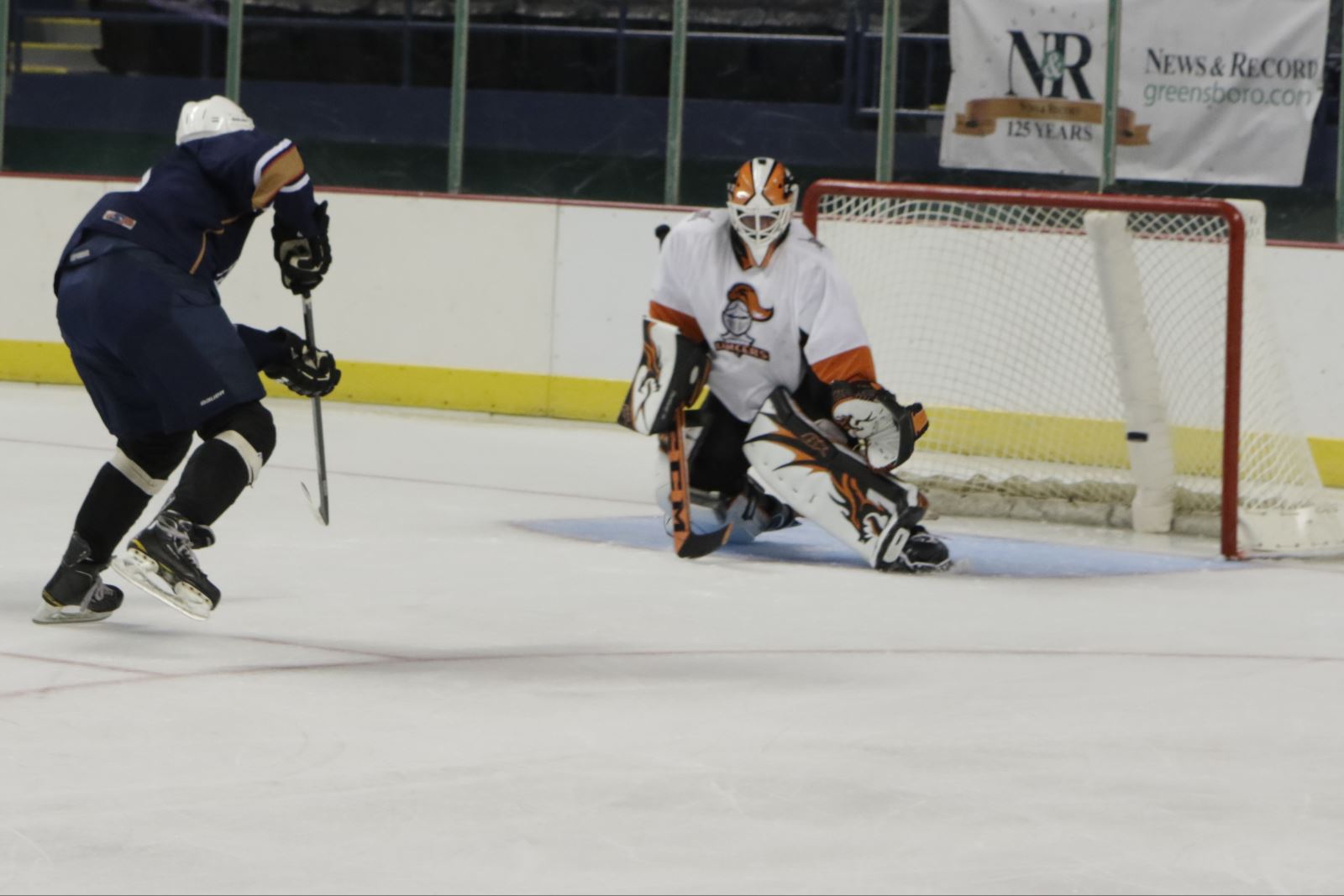 hockey player shooting on goal
