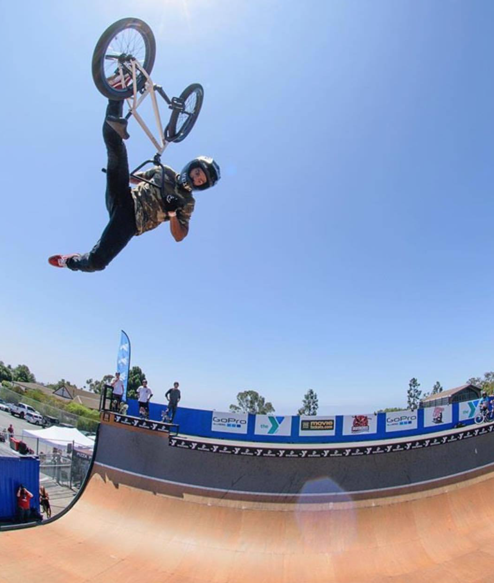 boy competing in bmx race