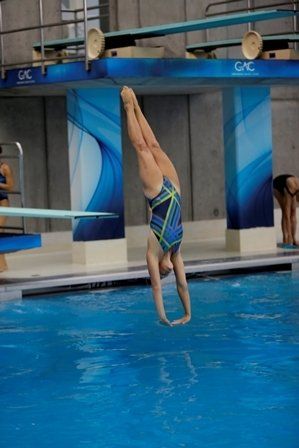 young girl diving from a diving board