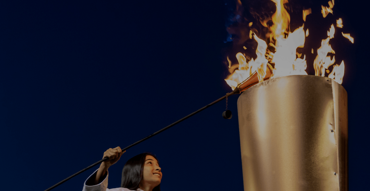 young girl lighting torch
