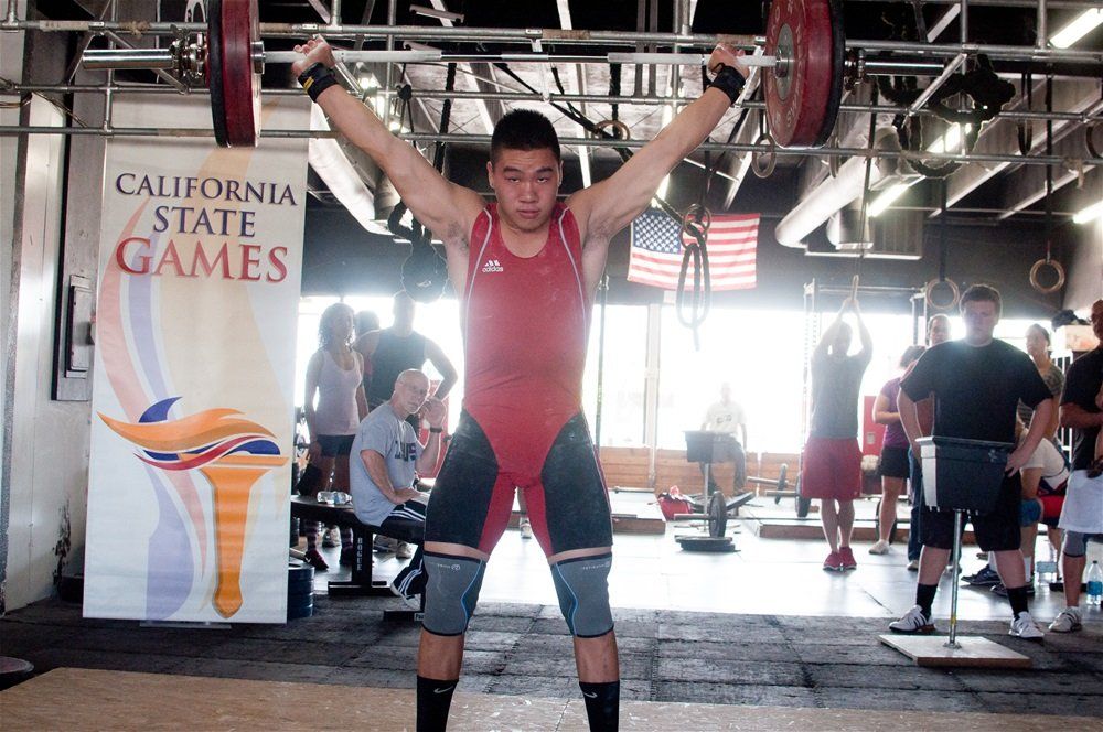 young boy powerlifting