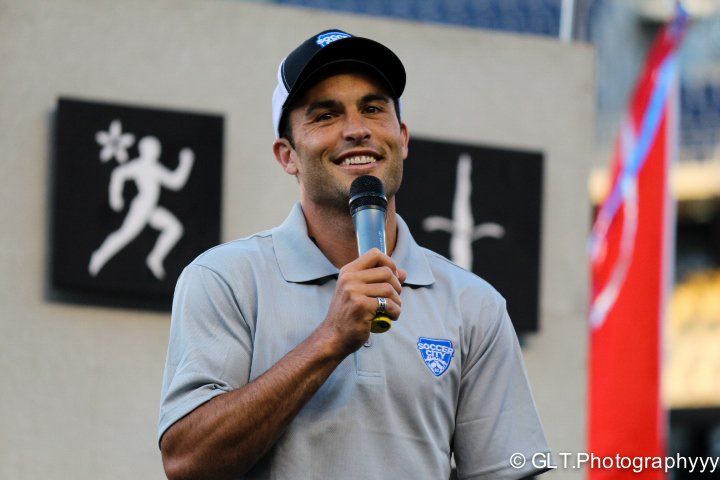 Young man announcing at soccer game