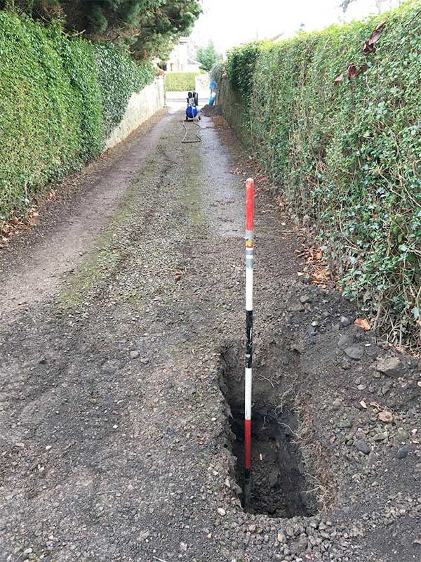 Impact moling on a dirt pathway