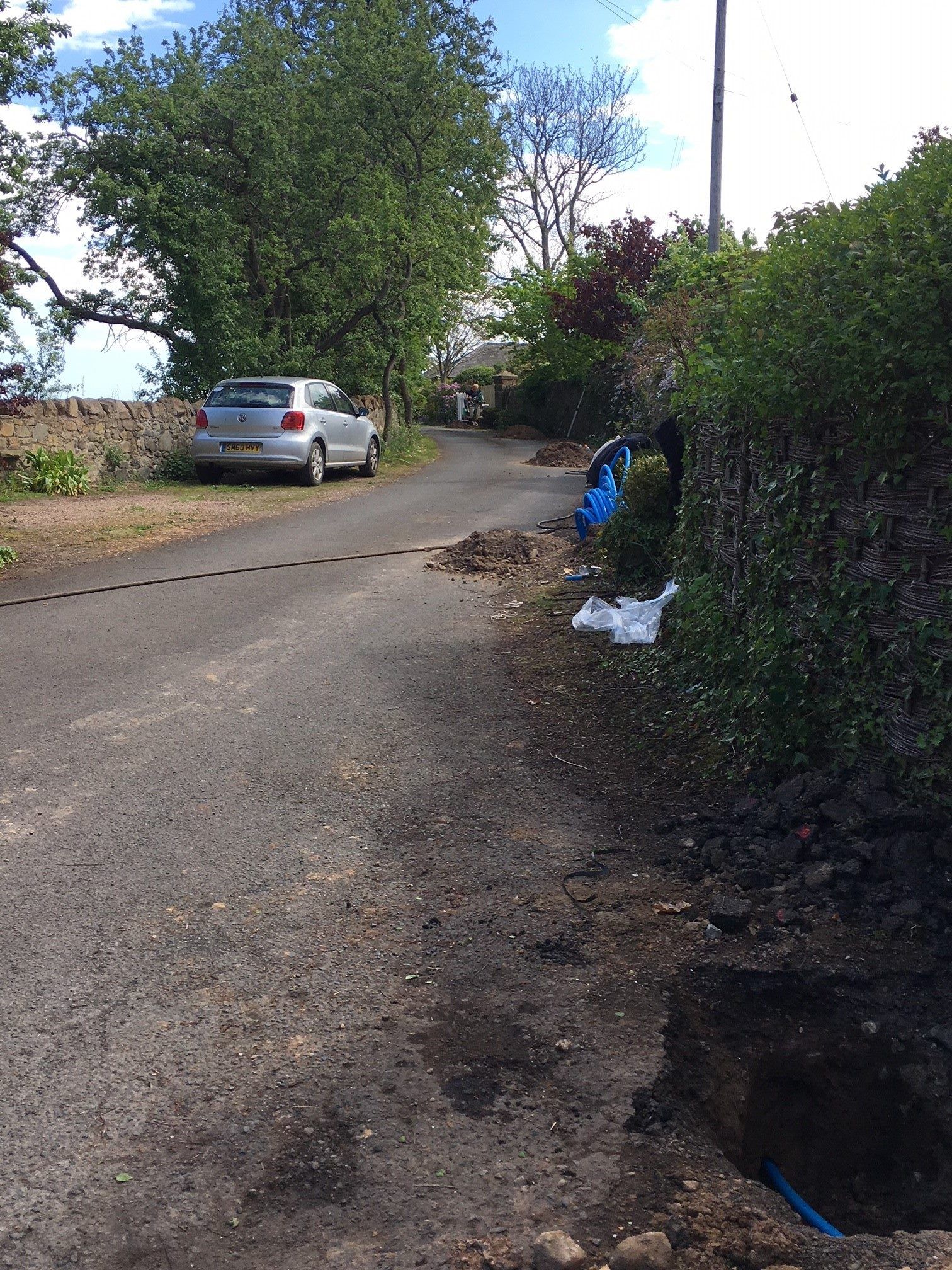 Trenchless moling across a road