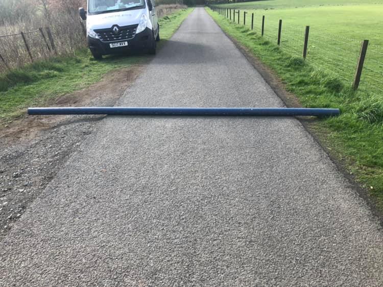 Trenchless moling under a single-track road