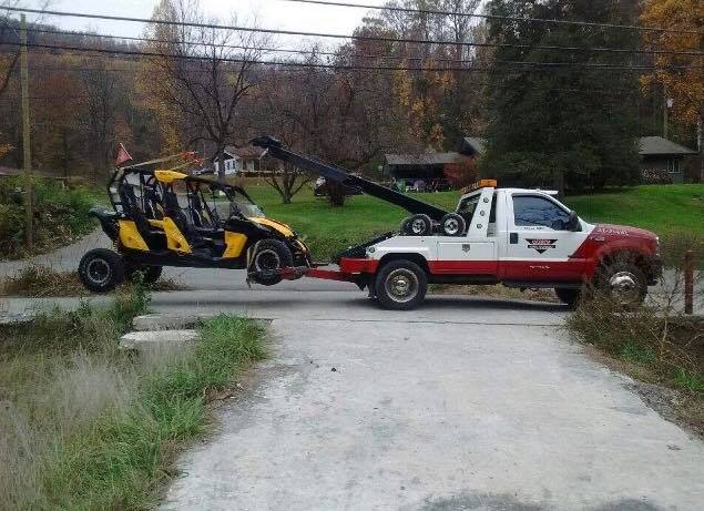 Tow truck towing a car — Pigeon Forge, TN — Carr's Auto Service Tow truck towing a car — Pigeon Forge, TN — Carr's Auto Service