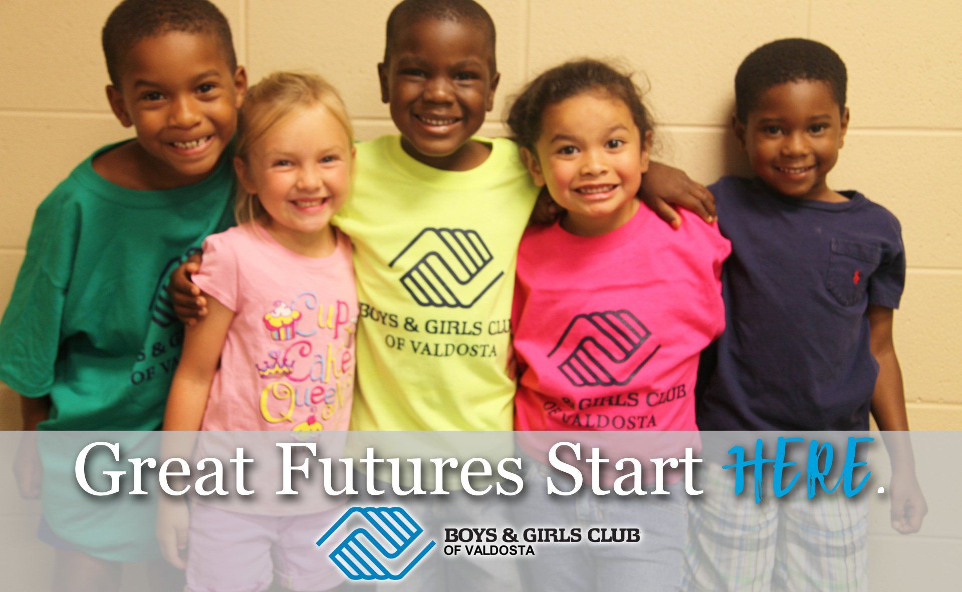 Group of smiling kids in colorful Boys & Girls Club shirts with Great Futures Start Here banner