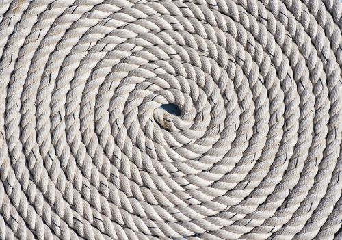 Coiled white rope, spiraling inward.
