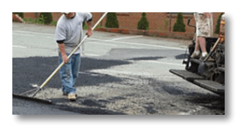 Asphalt Sealcoating — Worker in Charlottesville, Virginia Asphalt Sealcoating — Worker in Charlottesville, Virginia