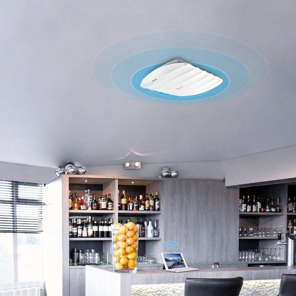 Modern kitchen with gray cabinets, glass shelves, and a ceiling light with blue trim