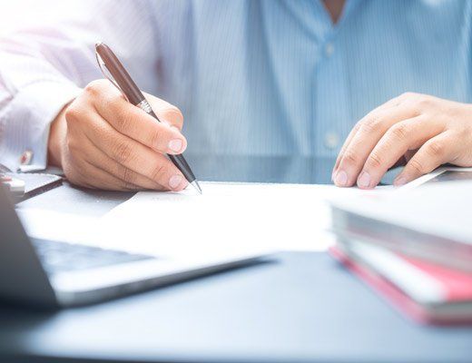 man working on paperwork