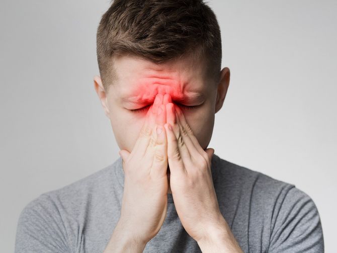 Frustrated Young Man Suffering Sinus Pressure