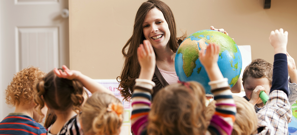 Kids playing with the teacher