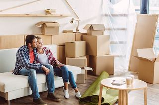 Bullring Storage — Couple with Belongings in the Boxes in Fort Collins, CO Bullring Storage — Couple with Belongings in the Boxes in Fort Collins, CO