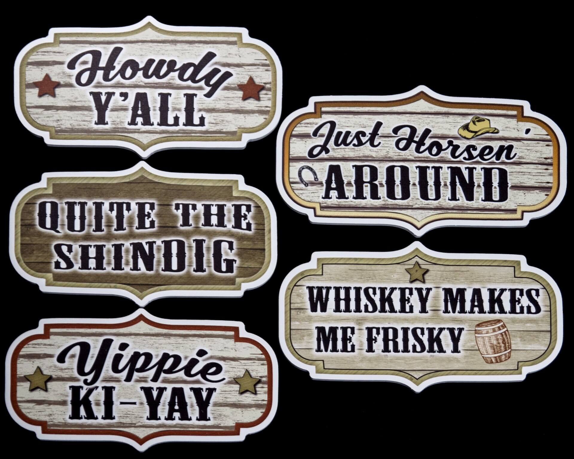 Western-themed photo booth props with phrases: 