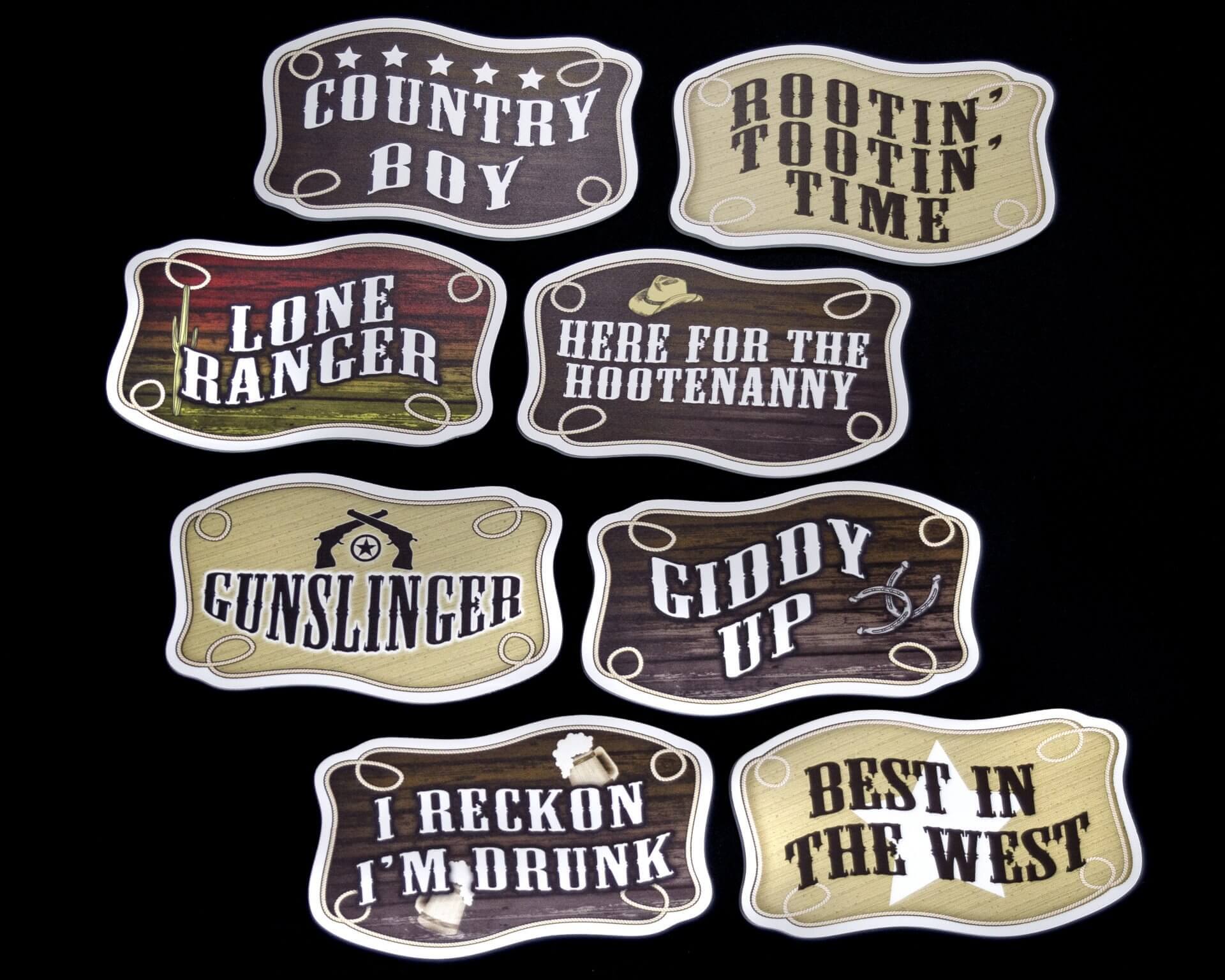 Ten Western-themed belt buckles with phrases like 