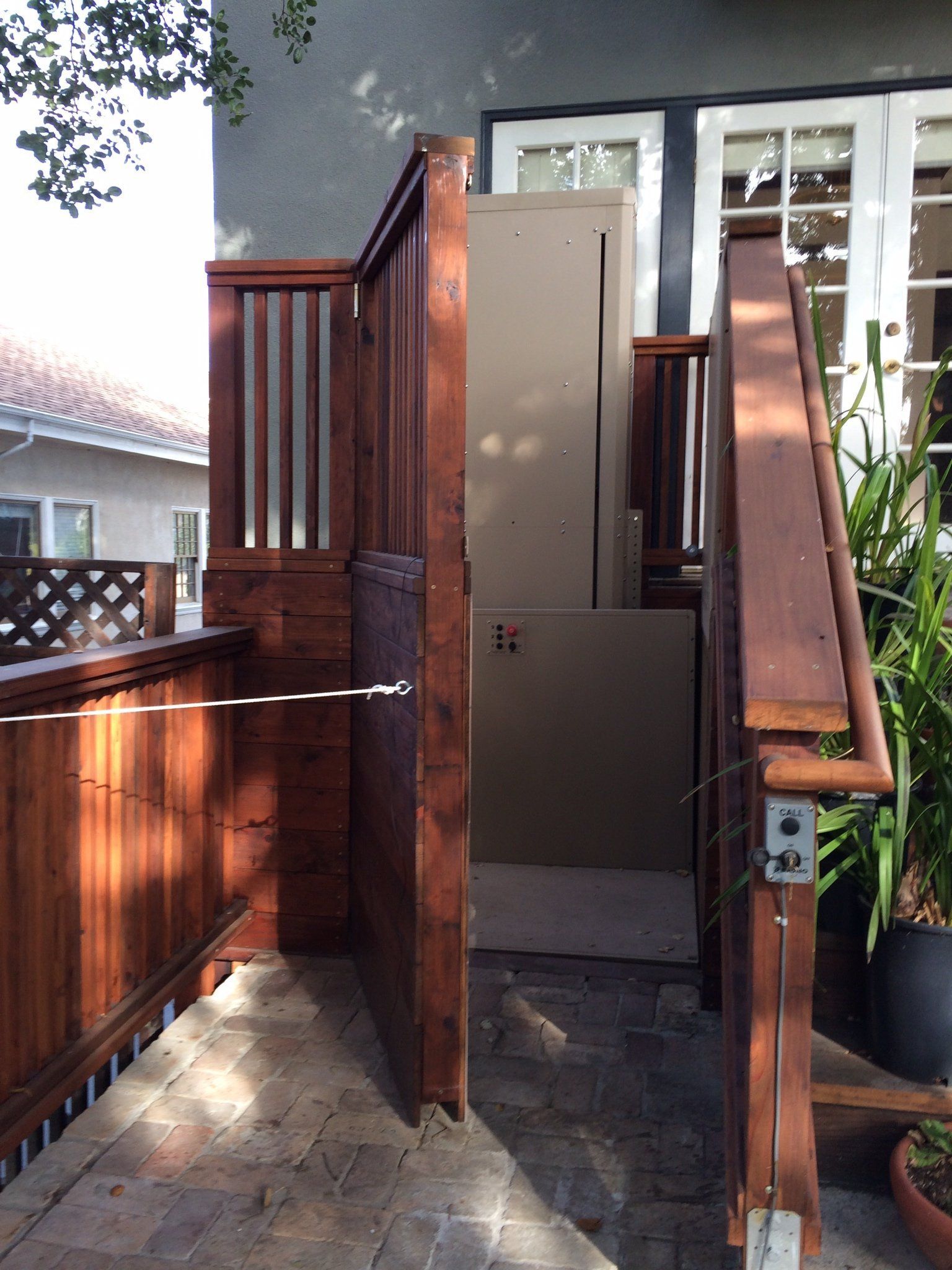 Door to wheelchair lift in backyard