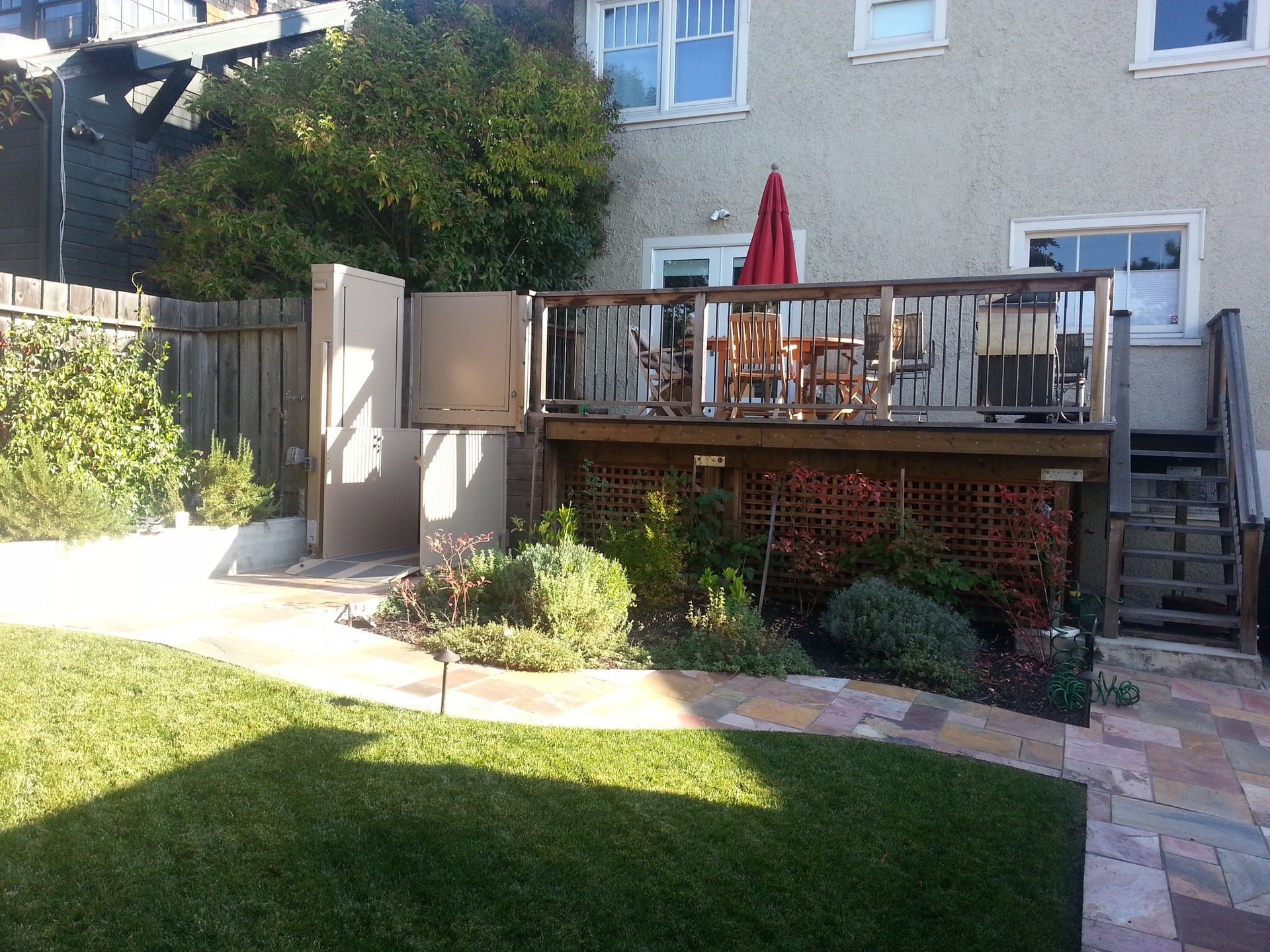 Backyard raised patio with wheelchair lift