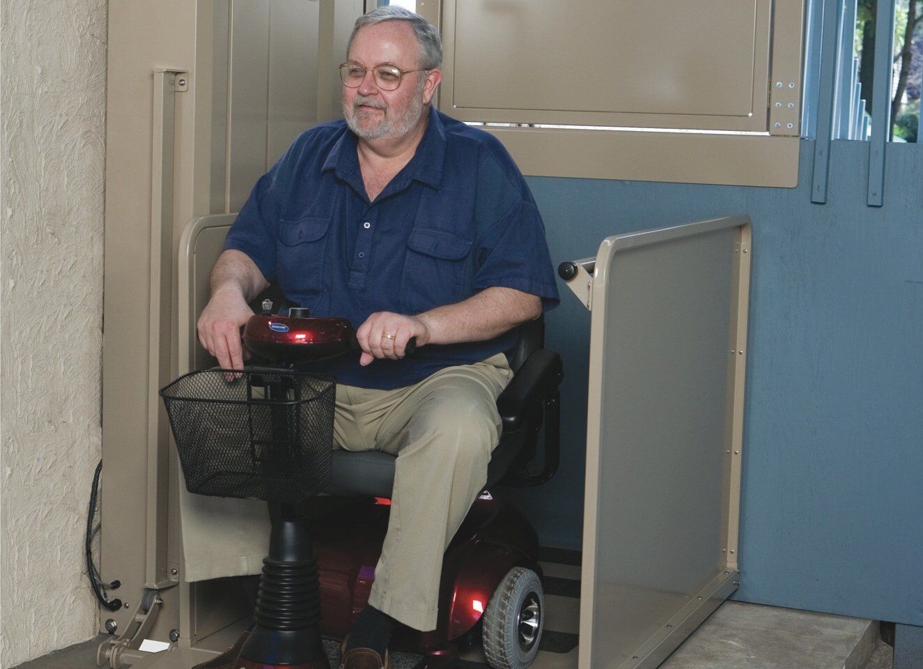 Man using a wheel chair lift in Berkeley, CA