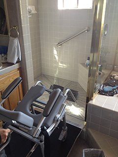 Wheelchair ramp into shower stall