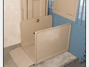 Vertical wheelchair lift for bathroom access