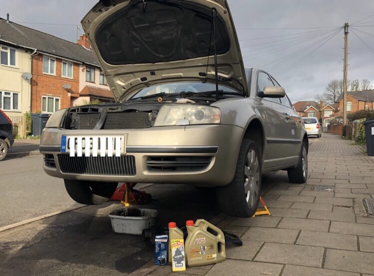 silver car with bonnet up