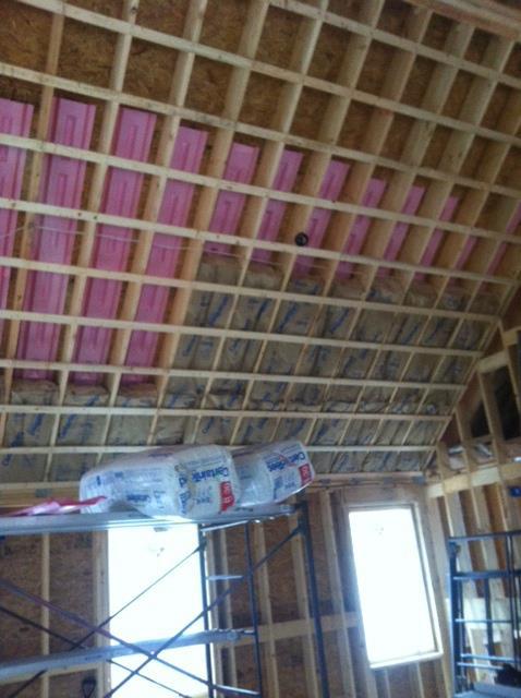 Fiberglass insulation being added to building in Windham, ME