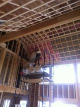 Insulation contractor on ladder while working