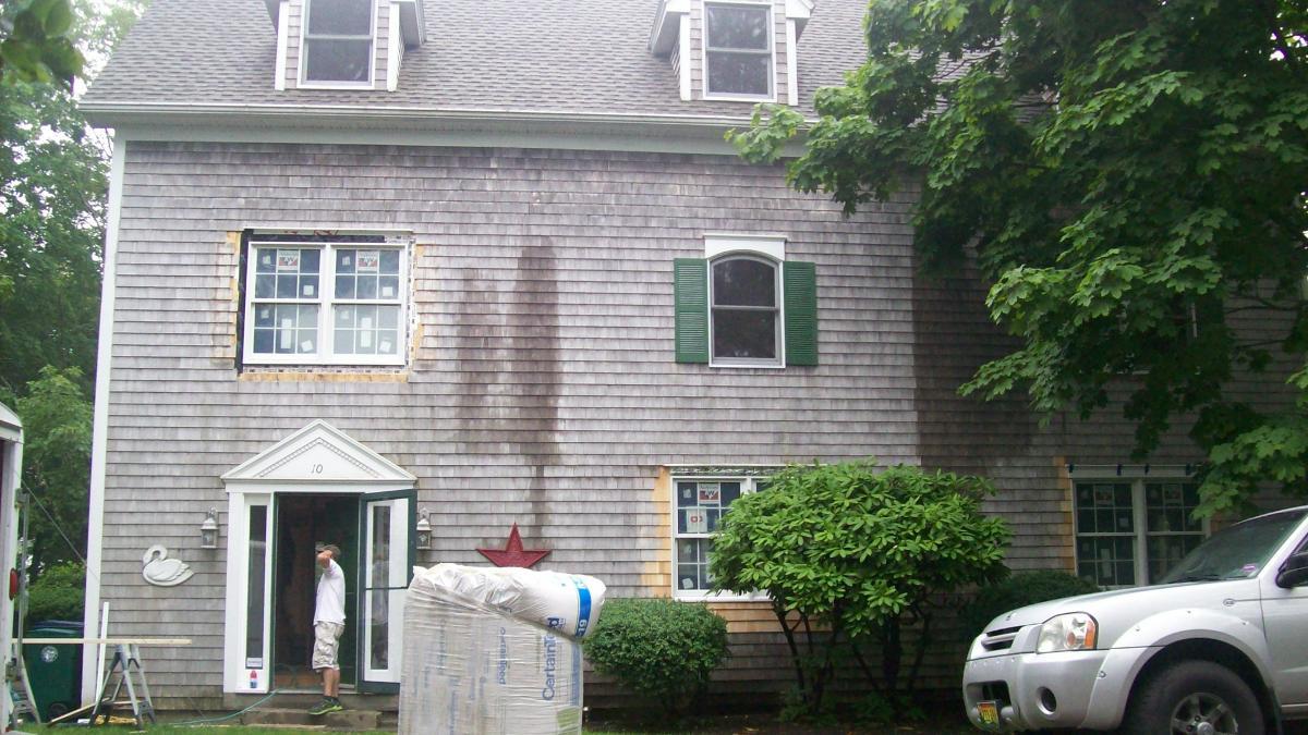 Bundle of fiberglass insulation sitting outside of home