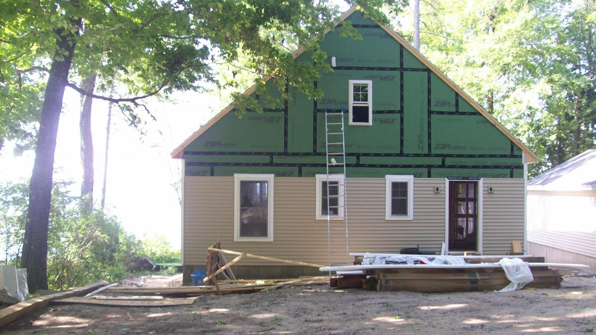 Ladder against exterior of Portland, ME home that our insulation contractors worked on.