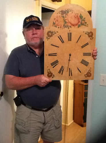 The Owner Holding An Old Clock — Charleston, SC — Captain Mikes Clock Shop The Owner Holding An Old Clock — Charleston, SC — Captain Mikes Clock Shop