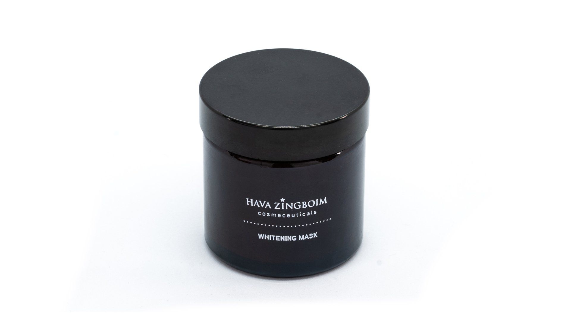 A black jar with a black lid is sitting on a white surface.