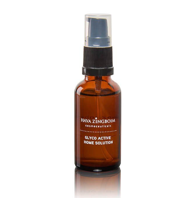 A bottle of glycer active home solution is sitting on a white surface.