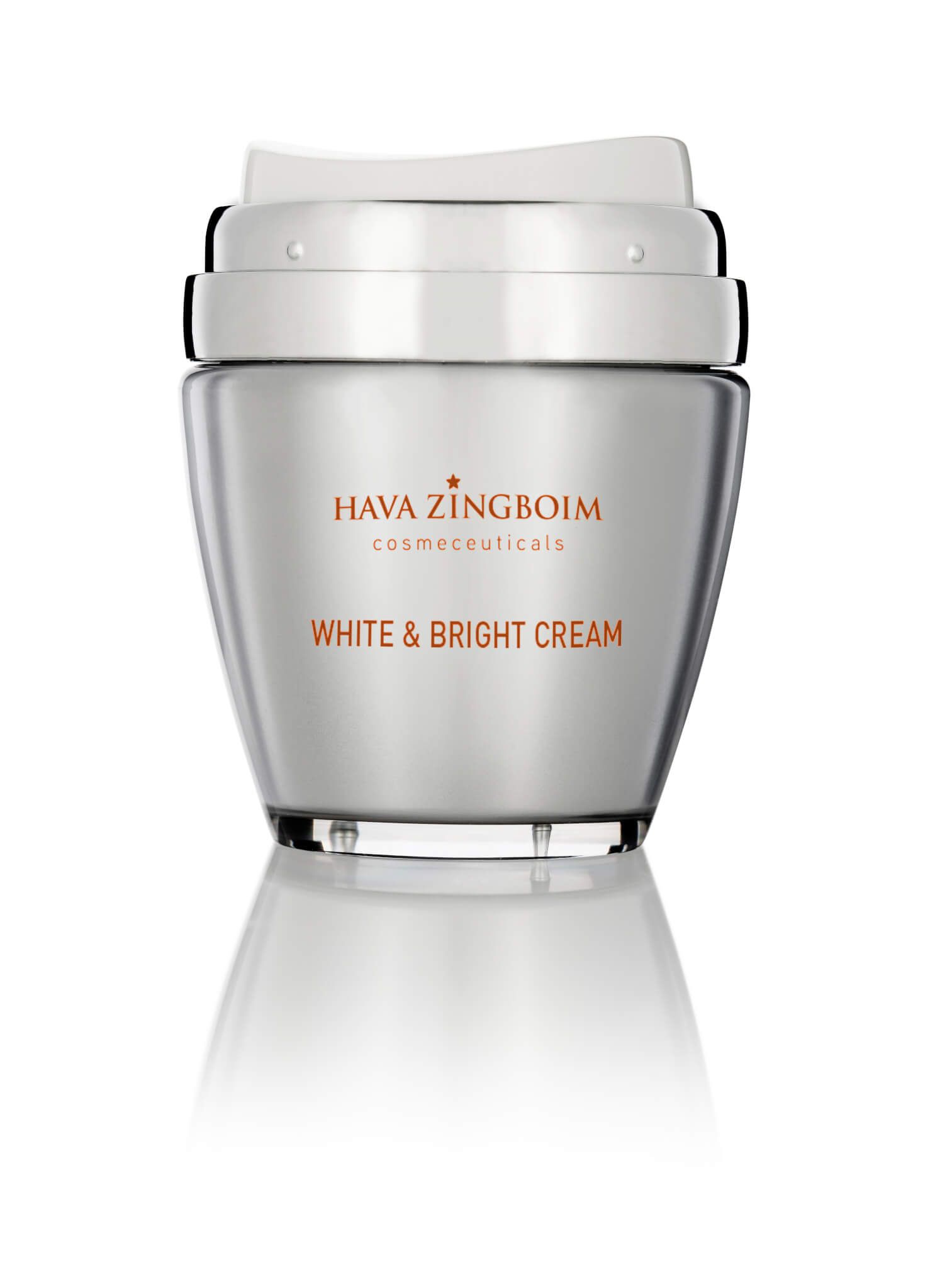 A bottle of white and bright cream is sitting on a white surface.