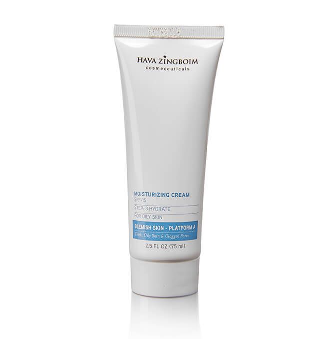 A tube of moisturizing cream is sitting on a white surface.