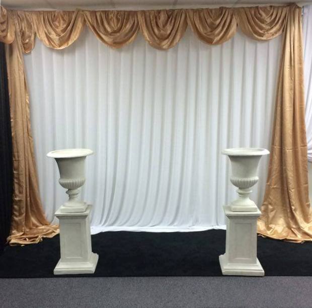 White chiffon wall draping with gold satin Venetian scallop and side drapes